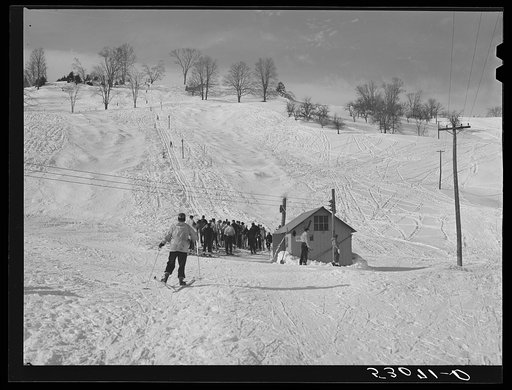 Every available space for parking is used by skiers on weekends at Clinton Gilbert's farm. The house is about eight years old; purchased by Gilbert in 1929. He has about 150 acres, mainly a dairy farm with twenty three cows. He also makes about one hundred gallons of maple syrup every year. First sk