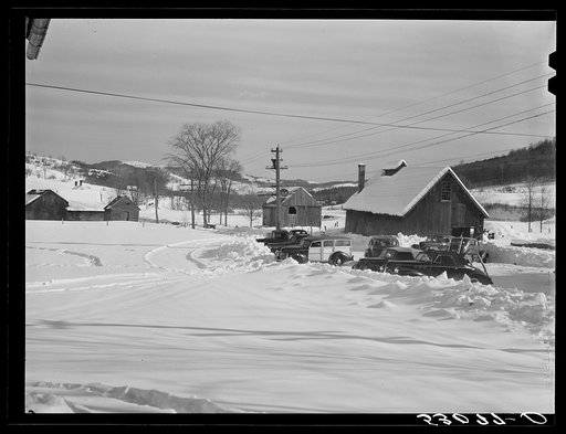 Every available space for parking is used by skiers on weekends at Clinton Gilbert's farm. The house is about eighty years old; purchased by Gilbert in 1929. He has about 150 acres, mainly a dairy farm with twenty-three cows. He also makes about one hundred gallons of maple syrup every year. First s