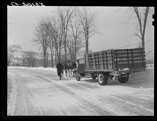Horses hauling frozen truck to gas station from Upwey farm. Woodstock, Vermont