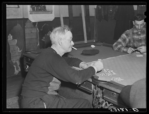 Proprietor of pool room and one of the townspeople playing cards on a winter morning. Woodstock, Vermont