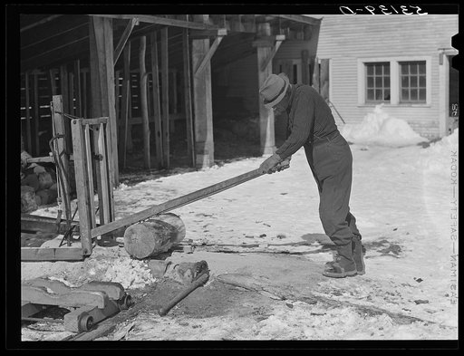 Sawing wood on farm. Woodstock, Vermont