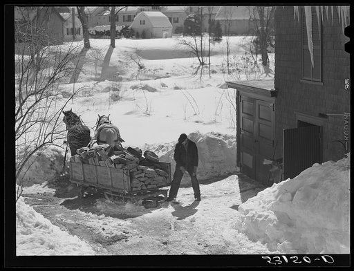 Untitled photo, possibly related to: Unloading stove wood from sled woodshed. Woodstock, Vermont