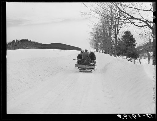 Untitled photo, possibly related to: Hauling water in milk cans after pipes have frozen. Putney farm, Woodstock, Vermont