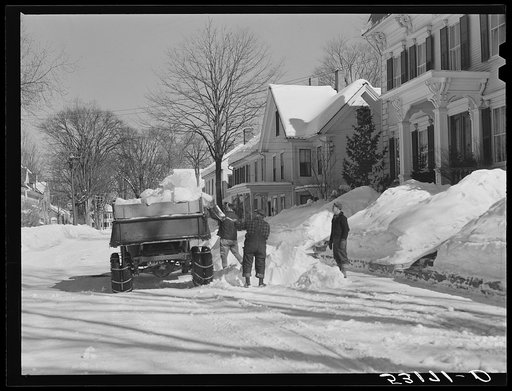 Clearing the banks of snow along main street in center of town. Woodstock, Vermont