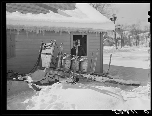 Untitled photo, possibly related to: Farmers bring their cans of milk to the crossroads early every morning, where they are picked up by large cooperative farmers trucks. Woodstock, Vermont