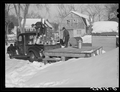 Farmers bring their cans of milk to the crossroads early every morning, where they are picked up by large cooperative farmers trucks. Woodstock, Vermont