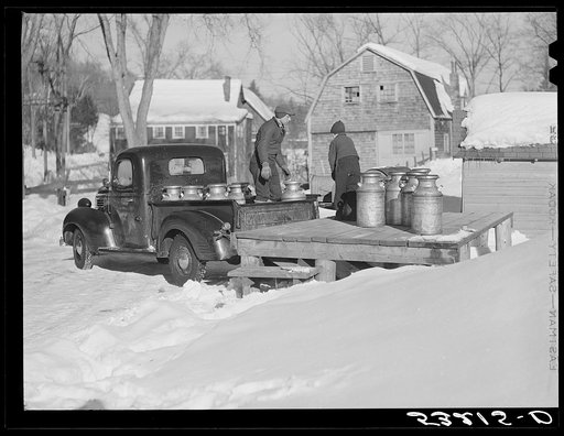 Farmers bring their cans of milk to the crossroads early every morning, where they are picked up by large cooperative farmers trucks. Woodstock, Vermont