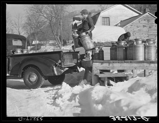 Untitled photo, possibly related to: Farmers bring their cans of milk to the crossroads early every morning, where they are picked up by large cooperative farmers trucks. Woodstock, Vermont