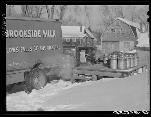 Farmers bring their cans of milk to the crossroads early every morning, where they are picked up by large cooperative farmers trucks, Woodstock Vermont
