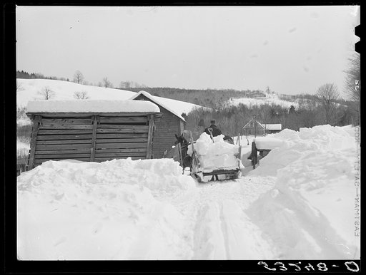Untitled photo, possibly related to: Clearing deep snow out of front barnyard so that if a thaw comes, the cellar and first floor of house and barn will not be flooded. Putney farm, Woodstock, Vermont