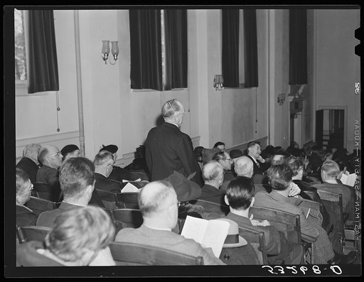 Discussion at town meeting about families who receive charity from the town. The overseer of the poor spoke about one man as a "miserable cuss" because he had left his wife and children on Christmas day without any food or fuel and spent what little money he had on liquor and women. Woodstock, Vermo