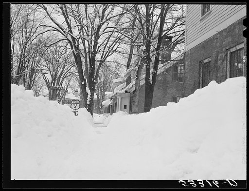 Woodstock, Vermont. Deepest snow in years piled up beside highways and sidewalks on main street