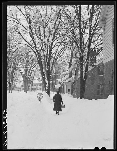 Deepest snow in years piled up beside highways and sidewalks on main street in Woodstock, Vermont