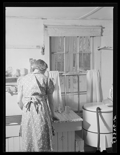 Untitled photo, possibly related to: A New England housewife fixing supper on winter night. Woodstock, Vermont