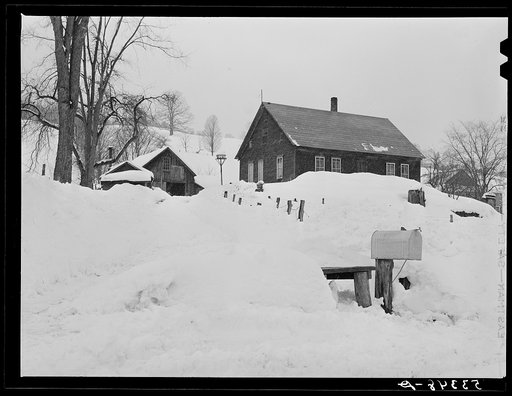 Farmhouse during snowstorm near North Hartland. Windsor County, Vermont