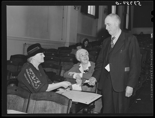 One of the town selectmen voting at town meeting. The women who gave him the ballot said, "If you vote yes for liquor, you'd better put your ballot in a box in a different town. We won't let you stay around here long." Woodstock, Vermont