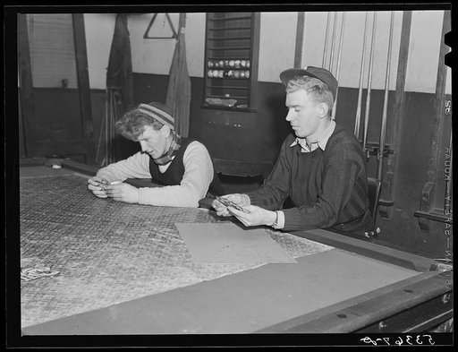 Farmer's son and friend playing cards in pool room on winter morning. Woodstock, Vermont