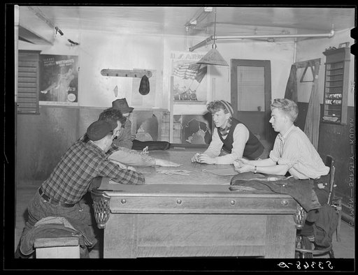 Farmers and townspeople playing cards in pool room on winter morning. Woodstock, Vermont