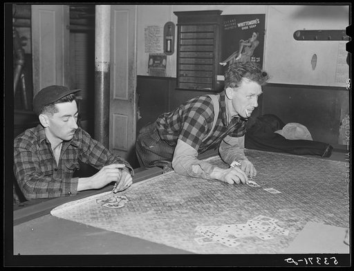 Farmers playing cards in pool room on winter morning. Woodstock, Vermont