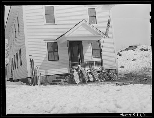 School, with children's sled and skis parked outside. Center Sandwich, New Hampshire