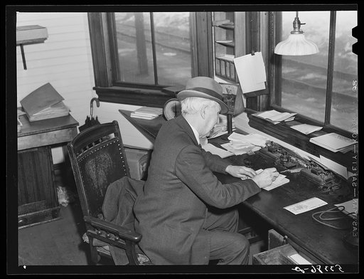 Ticket agent in railway station. Mount Whittier, New Hampshire