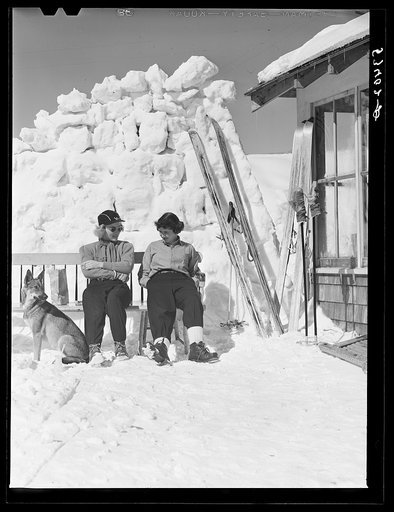 Untitled photo, possibly related to: Skiers relaxing outside of lodge. North Conway, New Hampshire