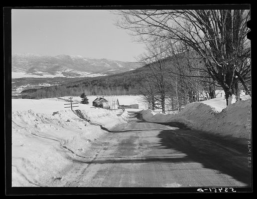 Farm and Green Mountains on road near Stowe, Vermont