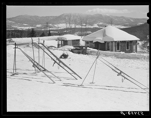 Skis in the sun outside the tollhouse during lunch hours at foot of Mount Mansfield, Smugglers Notch. Near Stowe, Vermont