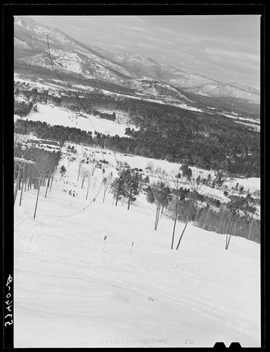 Untitled photo, possibly related to: Skiers on Cranmore Mountain with "ski mobile" on left. North Conway, New Hampshire
