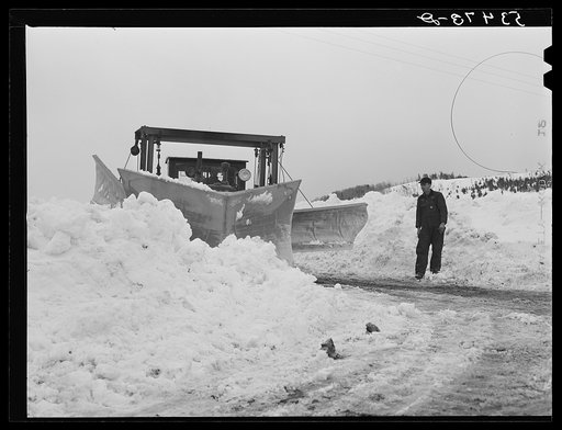 Clearing road with snow plows near Berlin, New Hampshire