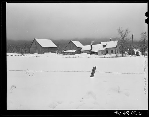 Farm in early morning with overhanging cloud covering mountain near North Conway, New Hampshire