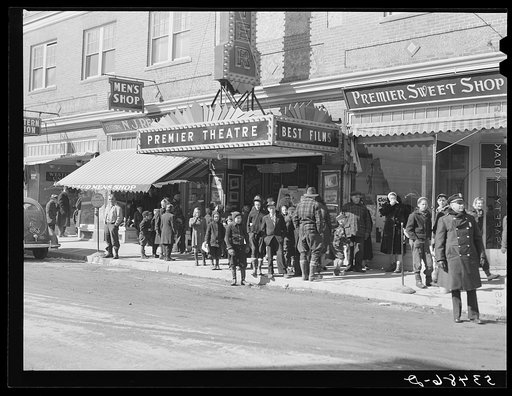 Children waiting to get in the movies on Saturday afternoon. Littleton, New Hampshire