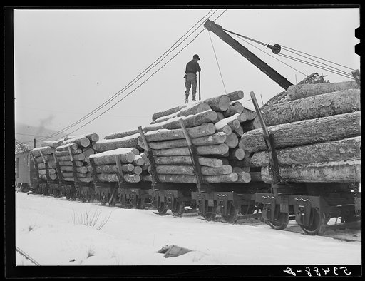 Unloading logs at paper mill in Lincoln, New Hampshire
