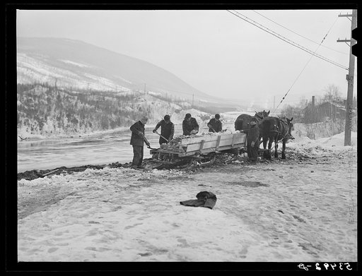 Dumping ice and snow from the streets of Berlin, New Hampshire into the river