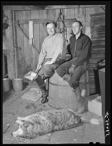 Untitled photo, possibly related to: Mr. Walter M. Gaylord, and his neighbor, George Wallis, discussing syruping in the sugar house while the sap is boiling into maple syrup. Waitsfield, Mad River Valley, Vermont