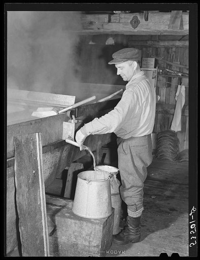 Walter M. Gaylord syruping off the maple sap has finally boiled down in the King evaporator to the correct syrup consistancy. He averages about 150 gallons annually, but this year tapped only 600 of his 1000 trees because of unusually deep snow and late spring. He owns several farms; in this particu