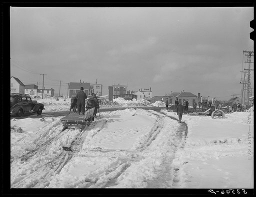 Hauling snow and ice from streets of Berlin, New Hampshire