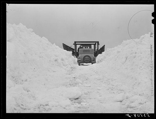 Clearing road with snowplow which got stuck near Berlin, New Hampshire