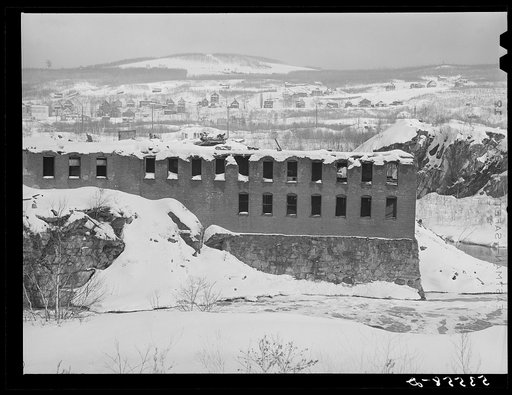 Old mill dynamited to avoid taxes after it was shut down about 1930. Berlin, New Hampshire, paper mill town inhabited largely by French-Canadians and Scandinavians
