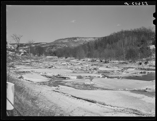Ice breaking up in river during spring thaw. Rutland, Vermont