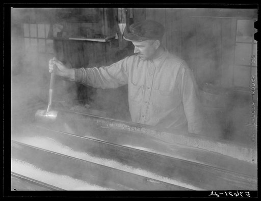 Untitled photo, possibly related to: Walter M. Gaylord dripping the boiled-down maple sap to see if it has reached correct consistency. Waitsfield, Mad River Valley, Vermont