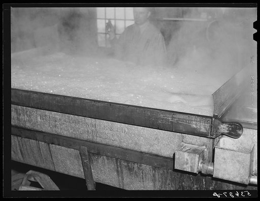 Boiling down sap into maple syrup in evaporator in Walter Gaylord's house in Waitsfield, Mad River Valley, Vermont. He averages about 150 gallons of syrup annually but this year tapped only 600 out of his 1000 trees, because of unusually deep snow and late spring. He owns several farms in this parti
