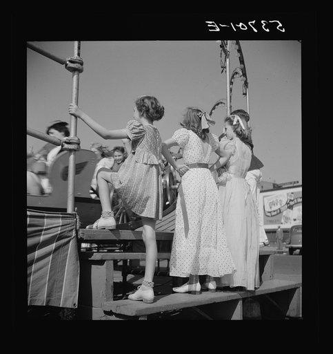 Children enjoying the midway after a parade at the Memphis cotton carnival. Memphis, Tennessee