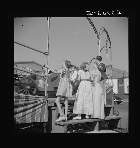 Untitled photo, possibly related to: Children enjoying the midway after a parade at the Memphis cotton carnival. Memphis, Tennessee