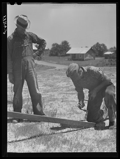 Farmers working outside woodworking shop. Community service center. Faulkner County, Centerville, Arkansas (see general caption)