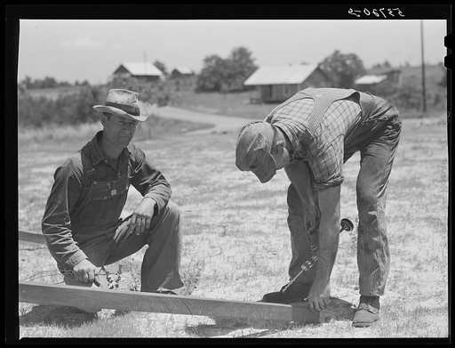Untitled photo, possibly related to: Farmers working outside woodworking shop. Community service center. Faulkner County, Centerville, Arkansas (see general caption)
