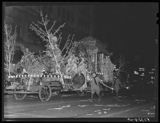 Float in night street parade during cotton carnival. Memphis, Tennessee