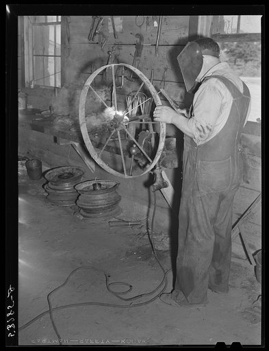 Working in blacksmith shop. Community service center, Faulkner County, Centerville, Arkansas (see general caption)