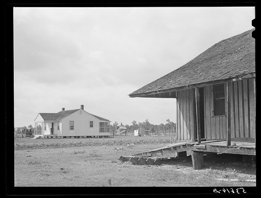 Old home and a new home on La Delta Project. Thomastown, Louisiana