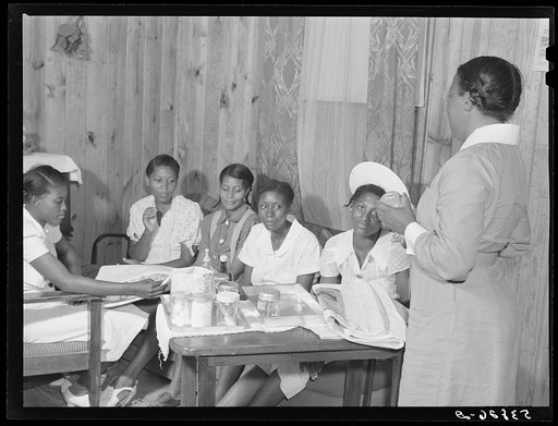 Nurse Marguerite White gives demonstration in postnatal care at mothers club maternity class at La Delta Project. Thomastown, Louisiana